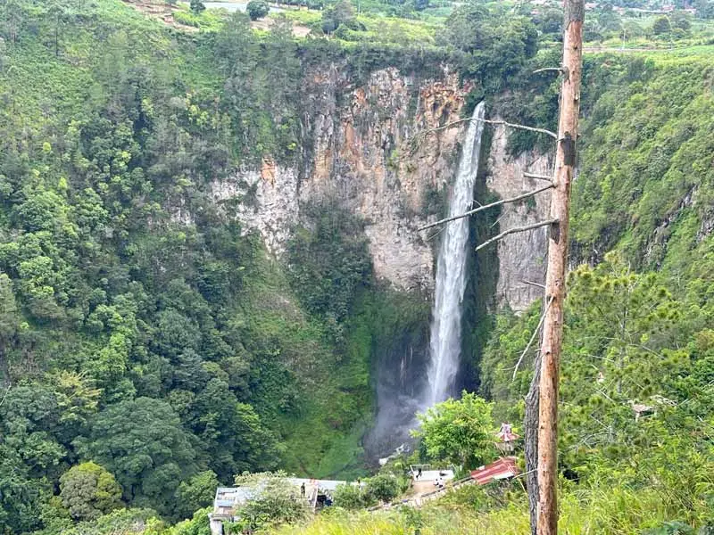 The majestic Sipiso-piso Waterfall plunging into the gorge.
