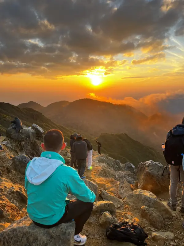 Golden sunrise view from the steaming crater of Mount Sibayak.